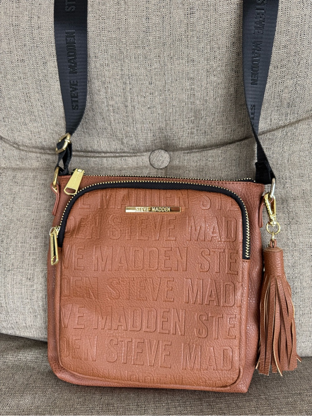 Steve Madden Tan faux Leather Crossbody Bag with Tassel and Logo Embossing